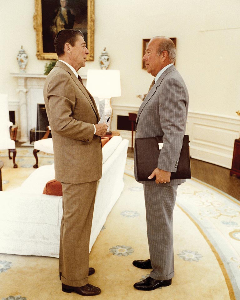 George Shultz and Ronald Reagan in the Oval Office.